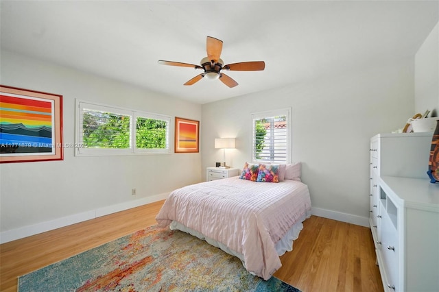 1259 NE 98th St, Miami Shores, FL 33138 - bedroom with baseboards, ceiling fan, and light wood-style floors