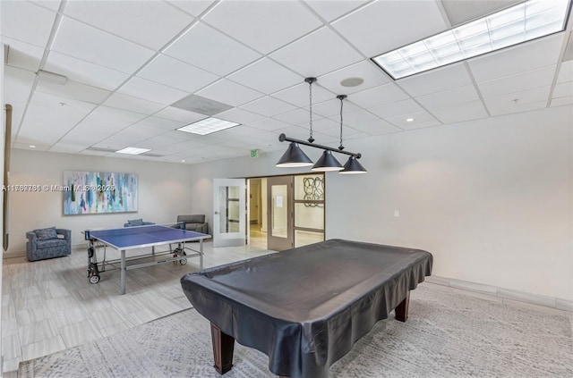 rec room with french doors, billiards, baseboards, and a paneled ceiling