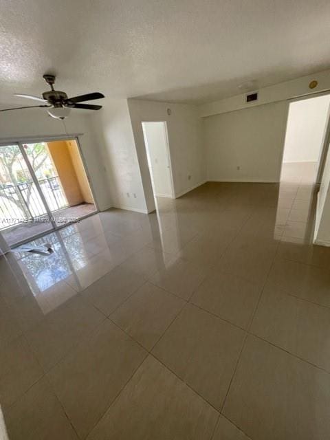 4271 San Marino Blvd Unit 206, West Palm Beach, FL 33409 - tiled spare room featuring a ceiling fan, visible vents, baseboards, and a textured ceiling