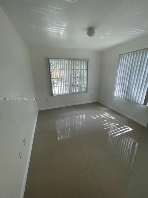 4271 San Marino Blvd Unit 206, West Palm Beach, FL 33409 - empty room featuring baseboards
