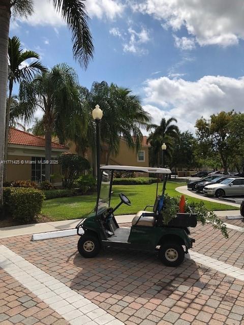 4271 San Marino Blvd Unit 206, West Palm Beach, FL 33409 - view of home's community with a lawn