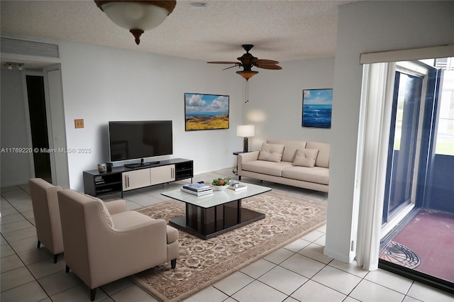 1170 N Hiatus Rd Unit 1170, Pembroke Pines, FL 33026 - living area featuring ceiling fan, light tile patterned flooring, and a textured ceiling