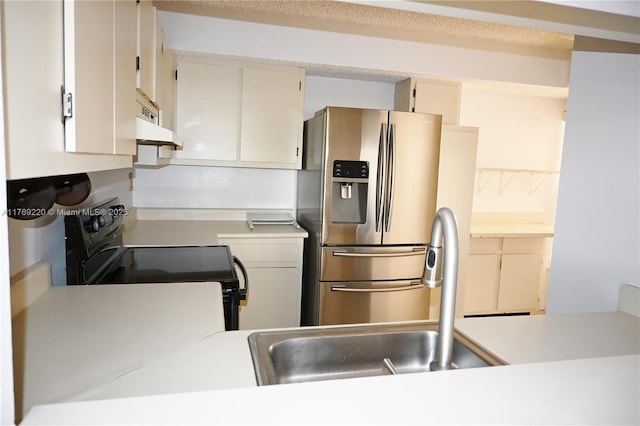 1170 N Hiatus Rd Unit 1170, Pembroke Pines, FL 33026 - kitchen with stainless steel fridge, electric range, light countertops, and under cabinet range hood