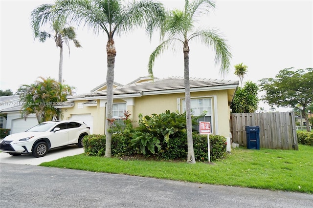12268 SW 145th St, Miami, FL 33186 - view of front of property with a garage, stucco siding, and a tiled roof