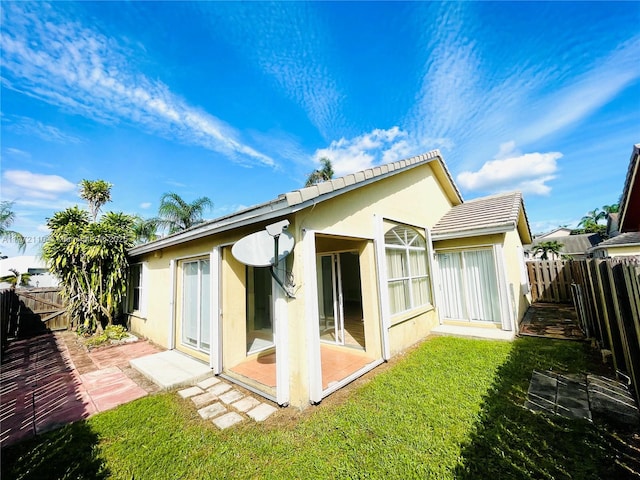 12268 SW 145th St, Miami, FL 33186 - back of property with a fenced backyard, stucco siding, and a patio