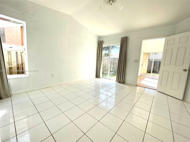 12268 SW 145th St, Miami, FL 33186 - spare room featuring lofted ceiling and light tile patterned flooring
