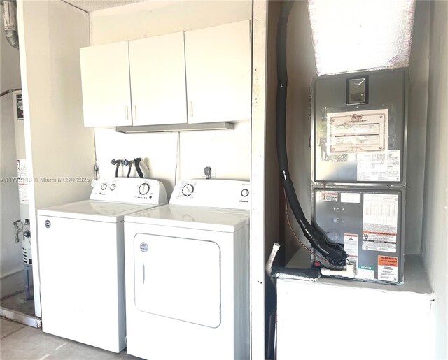 12268 SW 145th St, Miami, FL 33186 - laundry room featuring cabinet space and washing machine and dryer