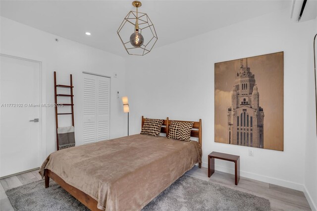 1610 Euclid Ave Unit A108, Miami Beach, FL 33139 - bedroom featuring a closet, baseboards, wood finished floors, and recessed lighting
