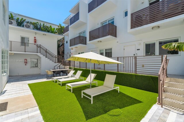 1610 Euclid Ave Unit A108, Miami Beach, FL 33139 - full bath with baseboards, marble finish floor, a marble finish shower, toilet, and vanity