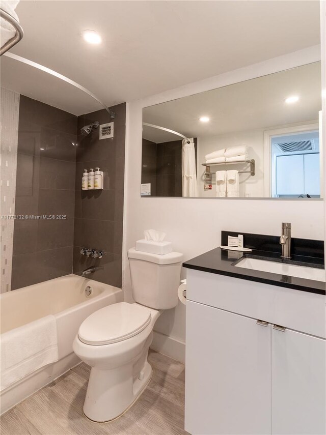 19201 Collins Ave Unit 425, Sunny Isles Beach, FL 33160 - full bathroom featuring vanity, toilet, recessed lighting, baseboards, and shower / tub combo