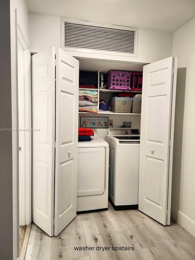 575 NW 98th Ave, Plantation, FL 33324 - laundry room featuring light wood-style flooring and washer and clothes dryer