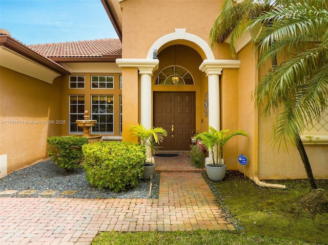 3091 SW 195th Ter, Miramar, FL 33029 - view of exterior entry featuring stucco siding and a tiled roof