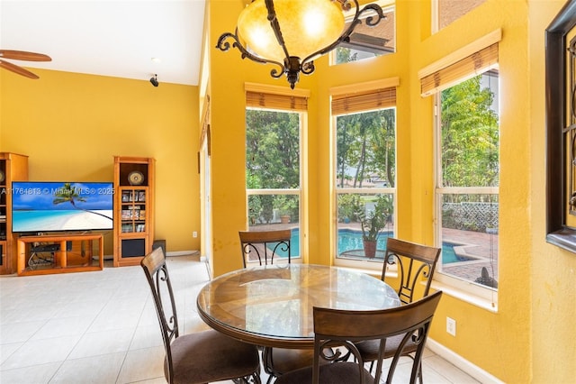3091 SW 195th Ter, Miramar, FL 33029 - tiled dining space featuring baseboards, ceiling fan, and a high ceiling