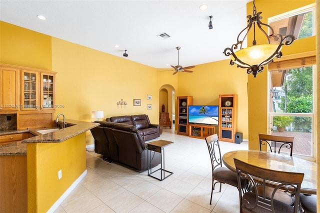 3091 SW 195th Ter, Miramar, FL 33029 - dining area with arched walkways, a ceiling fan, recessed lighting, light tile patterned floors, and visible vents