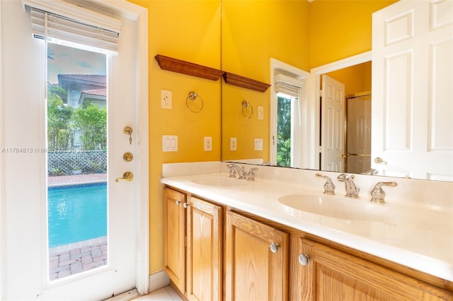 3091 SW 195th Ter, Miramar, FL 33029 - bathroom featuring double vanity, a sink, and tile patterned flooring