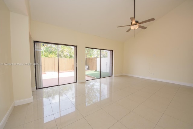 unfurnished room with baseboards, a ceiling fan, high vaulted ceiling, and light tile patterned floors