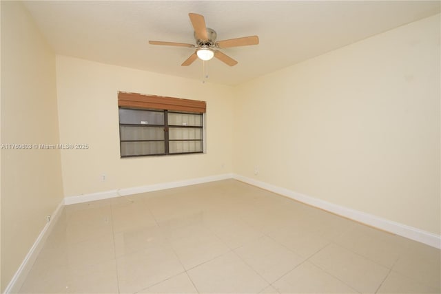 spare room with light tile patterned flooring, baseboards, and ceiling fan