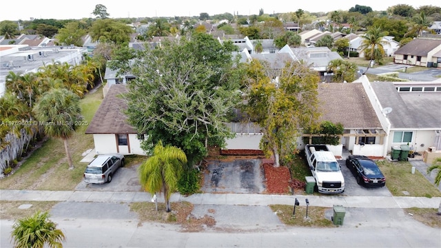 birds eye view of property with a residential view
