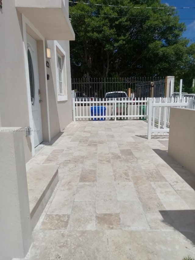 view of patio / terrace featuring fence