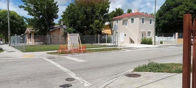view of road with sidewalks and curbs