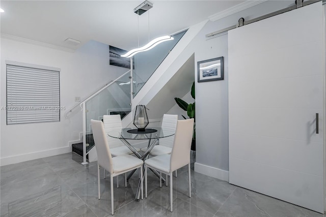 dining area with ornamental molding, baseboards, a barn door, and stairway