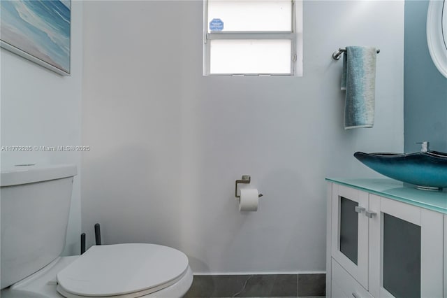bathroom with toilet and vanity