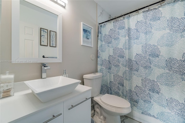 full bathroom featuring marble finish floor, toilet, curtained shower, and vanity