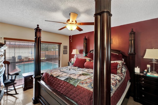 bedroom with a textured ceiling and a ceiling fan