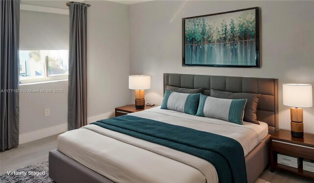 bedroom featuring wood finished floors