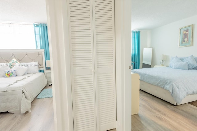 bedroom with a closet and wood finished floors