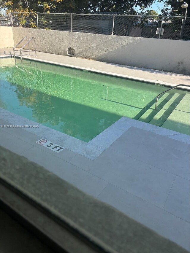 30 E 39th St Unit 325, Hialeah, FL 33013 - community pool featuring fence