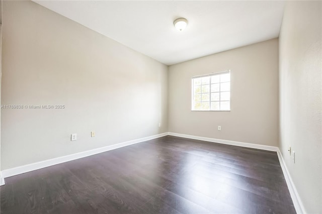 355 SE 20th Ave Unit 0, Homestead, FL 33033 - spare room with dark wood-type flooring and baseboards
