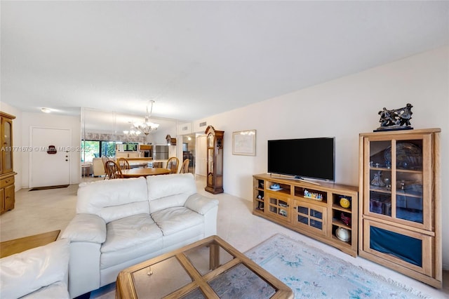 living room with visible vents, light tile patterned flooring, and a notable chandelier