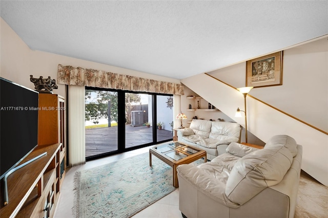 living room featuring a textured ceiling