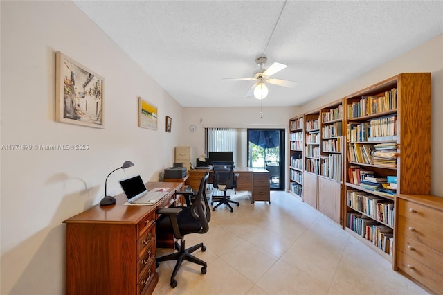 office featuring a ceiling fan, a textured ceiling, and light tile patterned floors