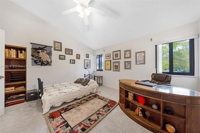 bedroom featuring ceiling fan, light carpet, and vaulted ceiling