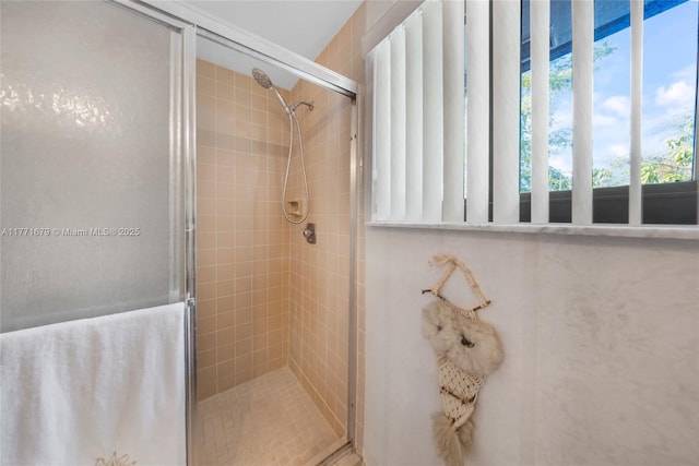 full bath featuring a shower stall