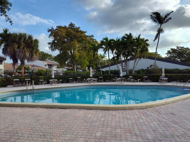 community pool with a patio