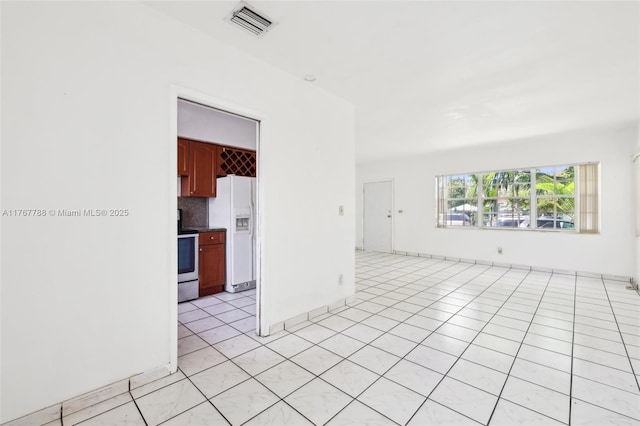 1121 SW 36th Ave, Miami, FL 33135 - spare room featuring light tile patterned flooring and visible vents