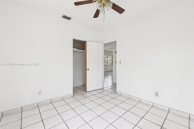 1121 SW 36th Ave, Miami, FL 33135 - unfurnished bedroom featuring a ceiling fan, light tile patterned floors, a closet, and visible vents