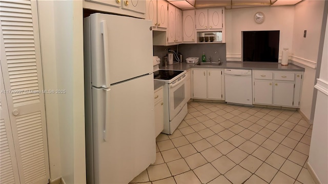 1680 NE 191st St Unit 107-2, Miami, FL 33179 - kitchen with white cabinetry, a sink, and white appliances