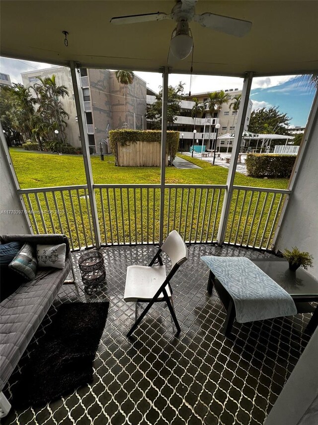 1680 NE 191st St Unit 107-2, Miami, FL 33179 - sunroom / solarium featuring ceiling fan