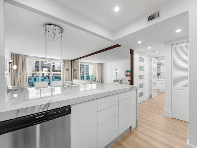 2301 Collins Ave Unit 603, Miami Beach, FL 33139 - kitchen with dishwasher, white cabinets, modern cabinets, light wood-style floors, and recessed lighting