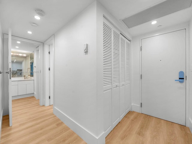 2301 Collins Ave Unit 603, Miami Beach, FL 33139 - hallway featuring light wood-style floors, recessed lighting, and baseboards