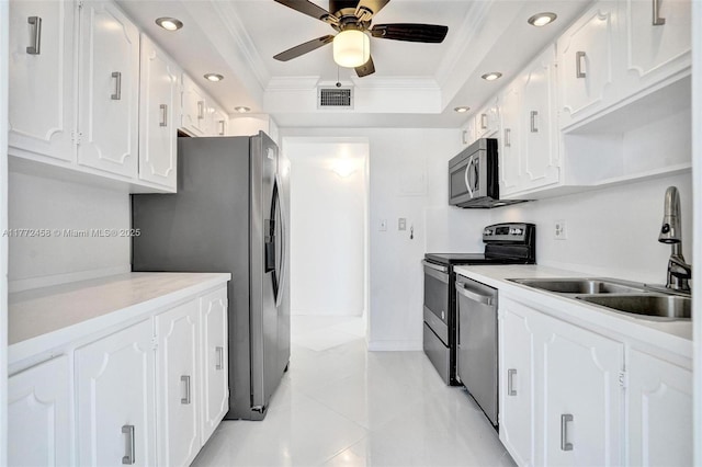 3113 S Ocean Dr Unit 410, Hallandale Beach, FL 33009 - kitchen featuring visible vents, ornamental molding, a ceiling fan, appliances with stainless steel finishes, and a sink