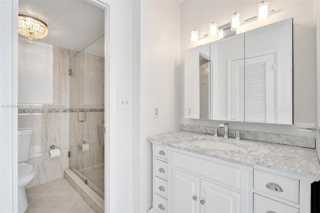 3113 S Ocean Dr Unit 410, Hallandale Beach, FL 33009 - full bathroom with tile walls, toilet, tile patterned floors, vanity, and a stall shower