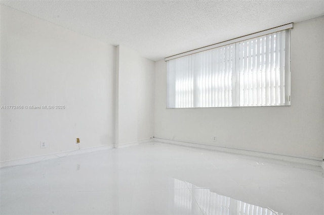 3113 S Ocean Dr Unit 410, Hallandale Beach, FL 33009 - unfurnished room with a textured ceiling