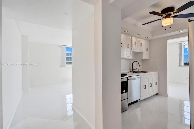 3113 S Ocean Dr Unit 410, Hallandale Beach, FL 33009 - kitchen featuring a healthy amount of sunlight, a sink, stainless steel appliances, and a raised ceiling