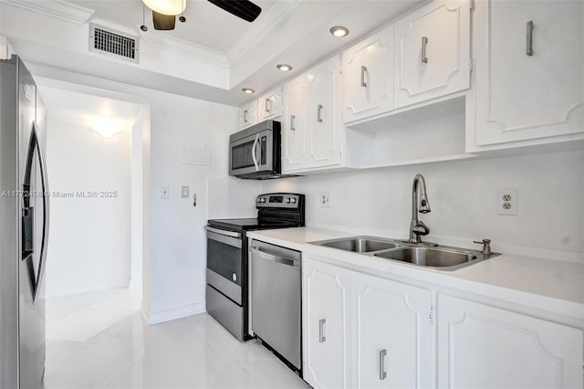 3113 S Ocean Dr Unit 410, Hallandale Beach, FL 33009 - kitchen with white cabinets, visible vents, ornamental molding, appliances with stainless steel finishes, and a sink