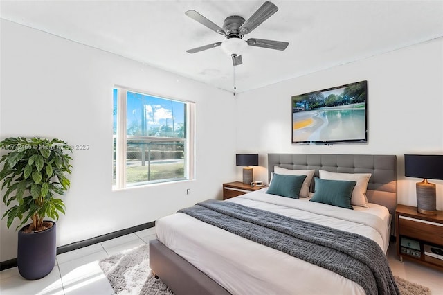 bedroom featuring baseboards, ceiling fan, and tile patterned flooring